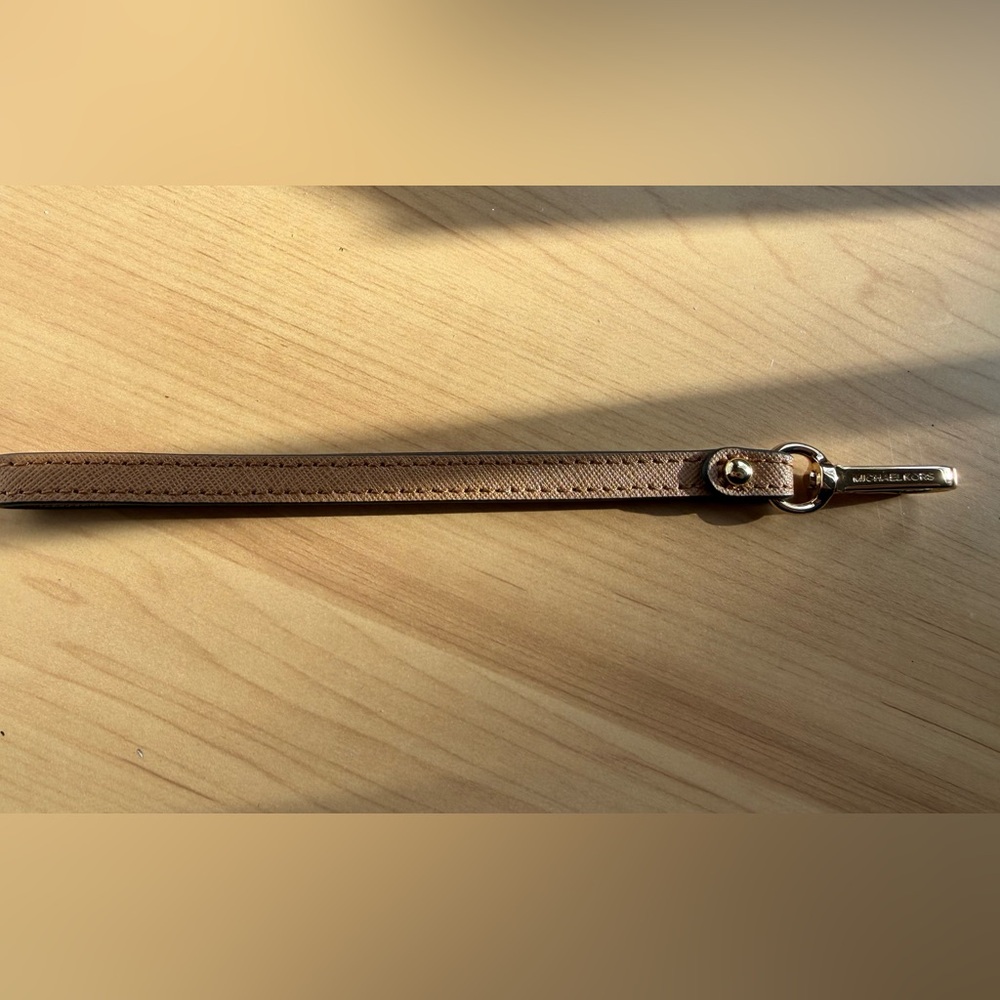 Elegant Brown Michael Kors wristlet strap gold clasp
